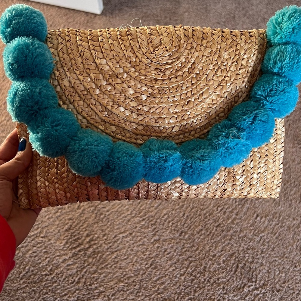 Blue Pom Pom beachy straw clutch with magnetic closure never used